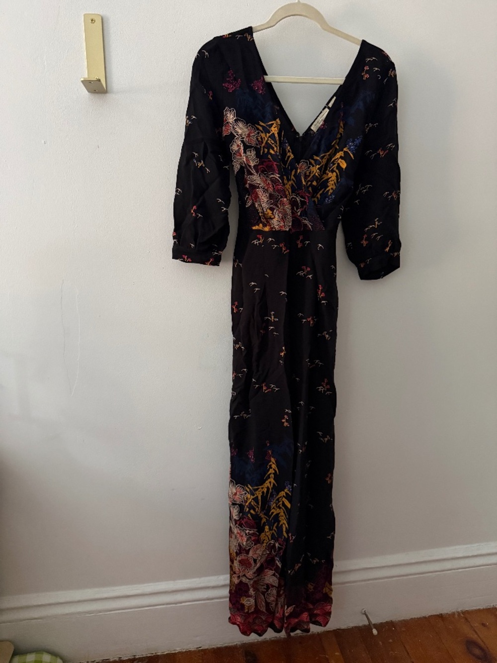 Anthropologie Jumpsuit with floral details.